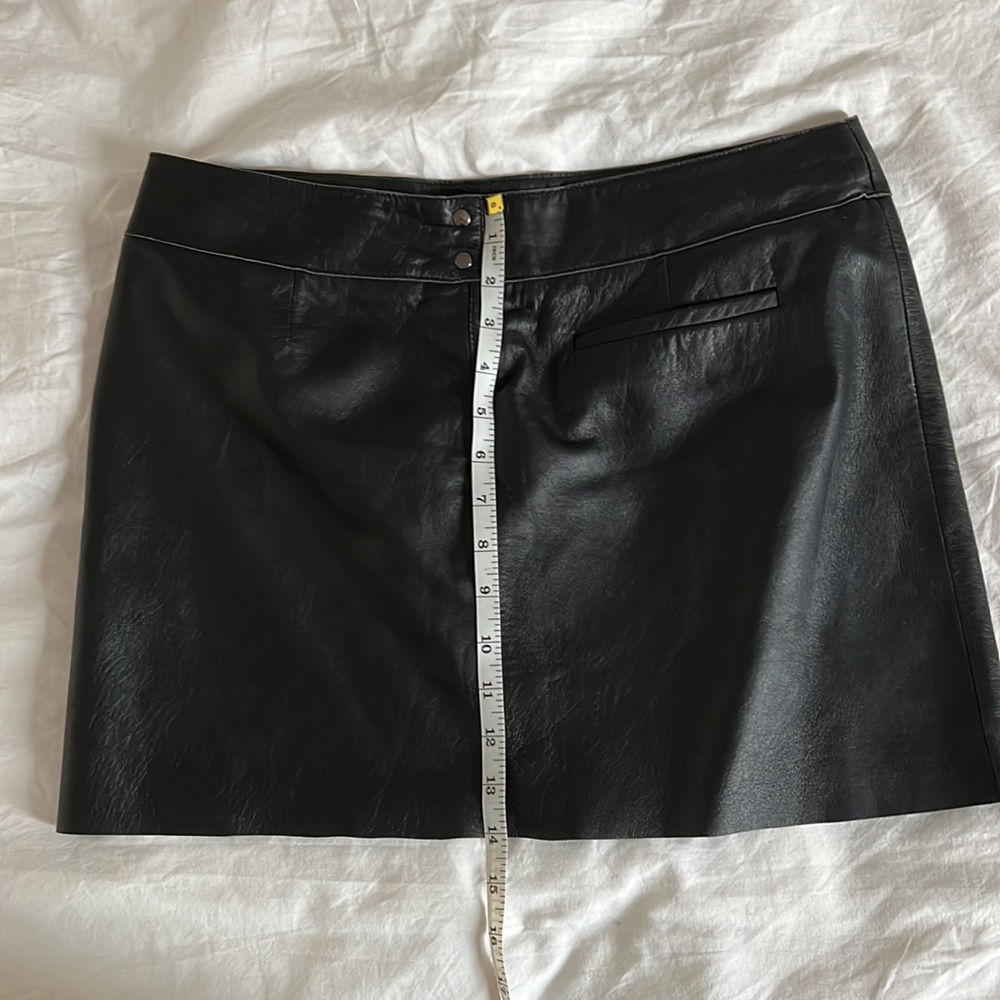 Express Genuine Soft Leather skirt. 2 buttons, zipper and right pocket size 9/10